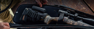 Person opening BONE-DRI Rust Prevention Shotgun & Rifle Case